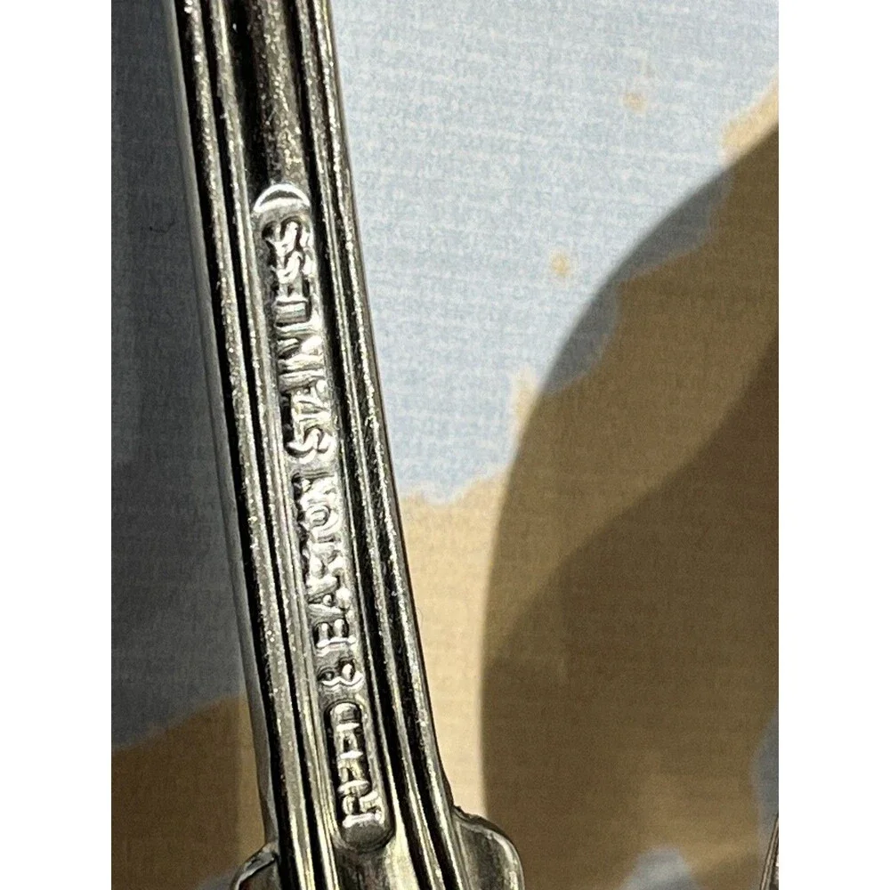 Reed & Barton Colonial Shell stainless-steel oval soup/place spoons.